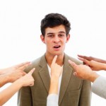 Closeup of human hands pointing towards business man